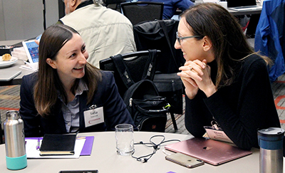 Two participants share a laugh.