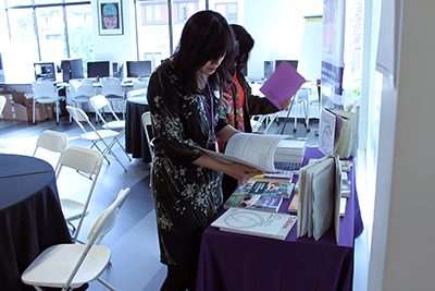 A participant looks at a brochure on the resources table.