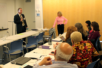 Scott and Sheryl present to the room.