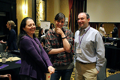 Co-PI Maya Cakmak laughs with participants.