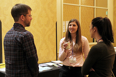 Co-PI Kat Steele talks with participants.