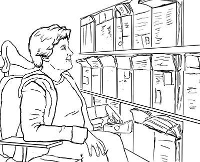 A student in a wheelchair looks at brochures in a display. A student in a wheelchair looks at brochures in a display.