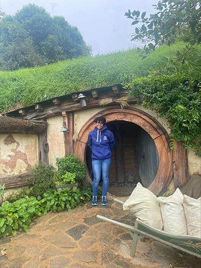 Alison in front of the Hobbit house