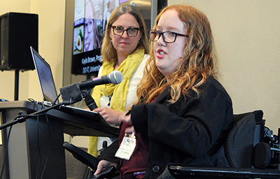 Kayla Brown presents using a mic and laptop at the AccessEngineering capacity building institute. Kayla Brown presents using a mic and laptop at the AccessEngineering capacity building institute.