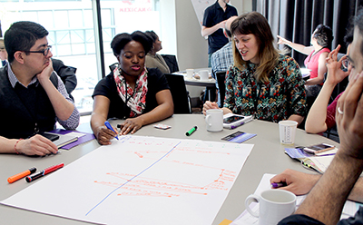 A few participants write down ideas at the AccessEngineering capacity building institute.