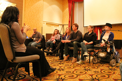 April2015-08b.jpg Panelists speaking and an interpreter at the Accessible IT CBI.