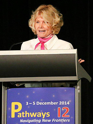 Sheryl Burgstahler standing at a podium at the Pathways 12 Conference.