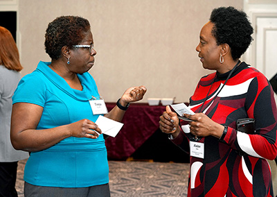 Two participants share ideas.