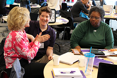 Sheryl Burgstahler discusses with a group. Sheryl Burgstahler discusses with a group.