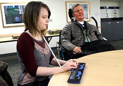 A student uses a braille display. A student uses a braille display.