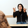 Image of a sign language interpreter in front of a class