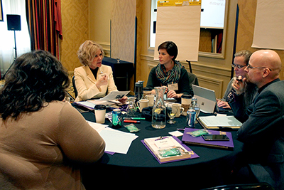 Sheryl and other Policy #188 coordinators discuss implementation efforts at the Policy #188 Capacity Building Institute.