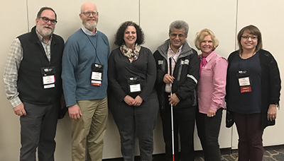 Dan Comden, Terrill Thompson, Linda Clemon-Karp, Hadi Rangin, Sheryl Burgstahler, and Ana Thompson at the 2018 Accessing Higher Ground conference. Dan Comden, Terrill Thompson, Linda Clemon-Karp, Hadi Rangin, Sheryl Burgstahler, and Ana Thompson at the 2018 Accessing Higher Ground conference.