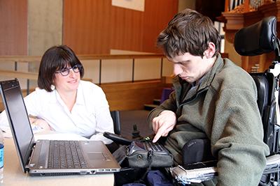 A mentor gives resume advice to a student. A mentor gives resume advice to a student.