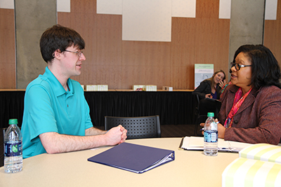 A mentor and student engage in a mock-interview.