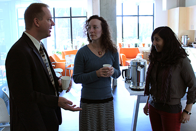 Scott Bellman and two AccessERC participants chat over coffee.