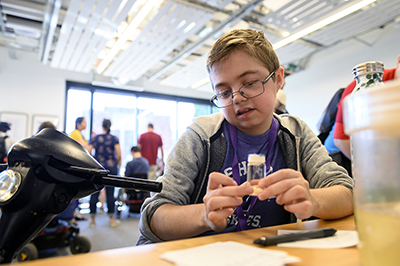 Student participates in accessible science.