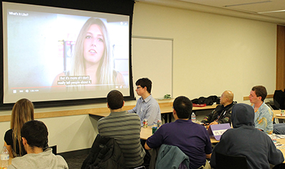 Participants watch a DO-IT video at a networking event. Participants watch a DO-IT video at a networking event.