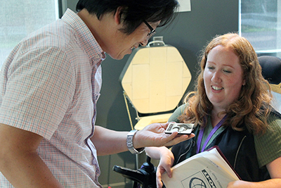 Jungsoo Kim, a visiting scholar from South Korea, attends a summer study session and learns about makerspaces with DO-IT staff member Kayla Brown.