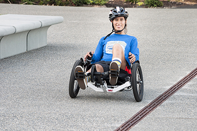 A scholar uses an accessible bike.