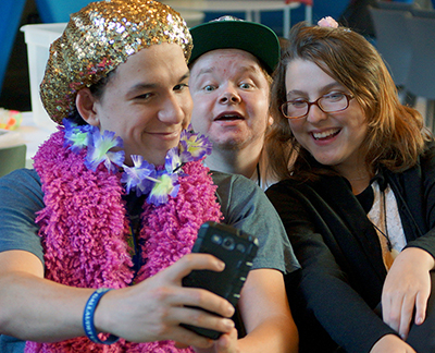 Scholars Adrian, Carl, and Rochelle take a silly selfie at craft night during Summer Study 2016.