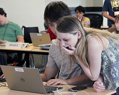 Scholars Takashi and Courtney have fun in a computer class during Summer Study 2016.