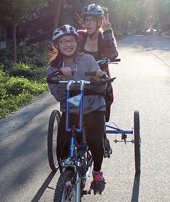 Phase II Scholars, Chana and Katelyn try out a two-person accessible bicycle during Summer Study 2016. Phase II Scholars, Chana and Katelyn try out a two-person accessible bicycle during Summer Study 2016.