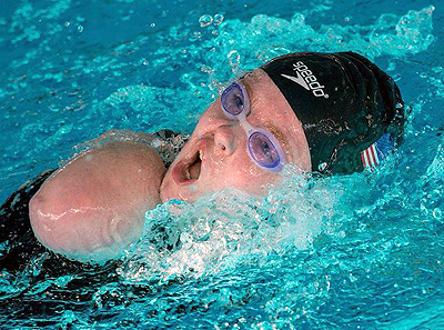 DO-IT Scholar Kayla turns to take a breath during a swimming competition Photo of DO-IT Scholar Kayla turning to take a breath during a swimming competition