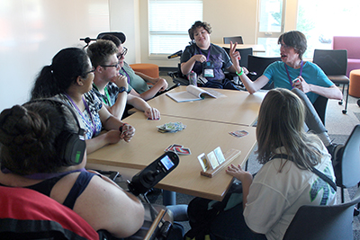 DO-IT Scholars playing a card game.