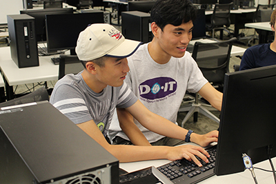 Two students using a computer.