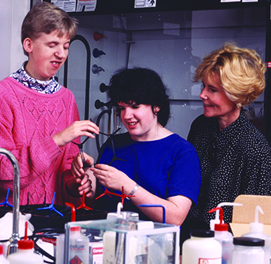 Sheryl helps two students complete a science experiment during Summer Study 1995. Sheryl helps two students complete a science experiment during Summer Study 1995.