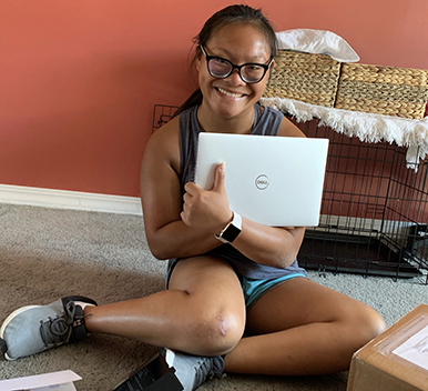 A 2021 Scholar shows off her brand new laptop.