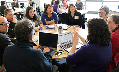 One participant signs to a group.