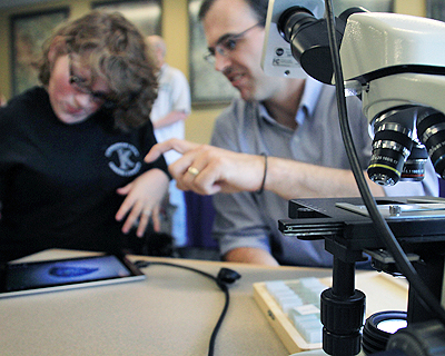 Instructor demonstrating an application to a student Image of an instructor demonstrating an application to a student