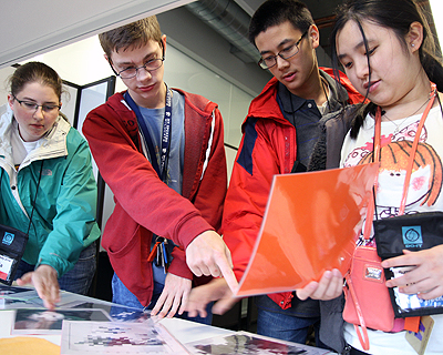 Students looking at images together in a lab.