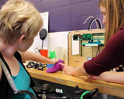 Image of an instructor demonstrating a prosthetics lab to a student