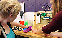 Image of an instructor demonstrating prosthetic modeling to a student