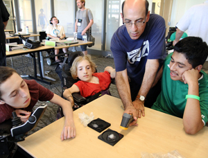 Image of instructor demonstrating for students in a science lab