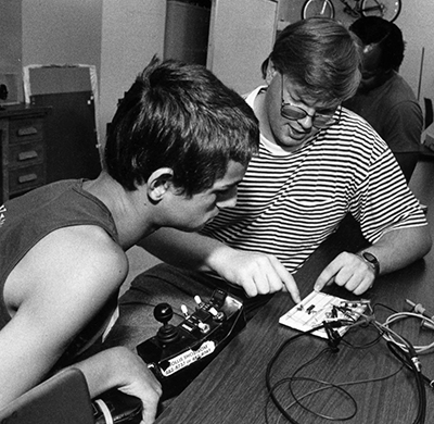 A mentor works with a student during Summer Study 1994.