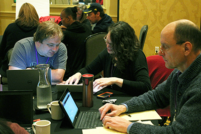 Participants type at computers to record their ideas.