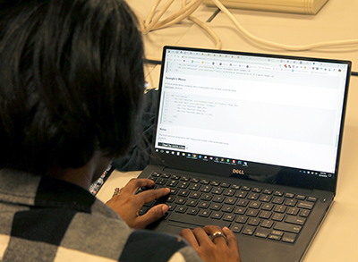 A person types on a computer.