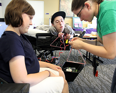 Image of students working together on a team building project