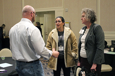 Several participants discuss about the conference.