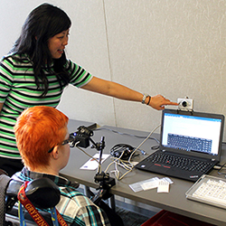 An instructor shows a student accessible technology.