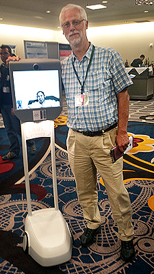 Kavita.jpg Richard Ladner standing next to Kavita on the monitor of her Beam robot.
