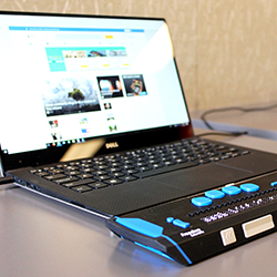A laptop and Braille interface.