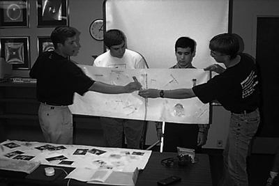 Students making a group presentation. Photo of students making a group presentation.
