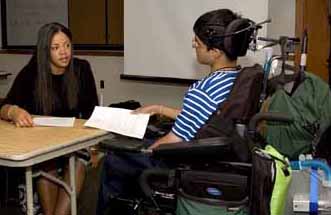 DO-IT Scholar talking to someone across a table. Picture of DO-IT Scholar talking to someone across a table.