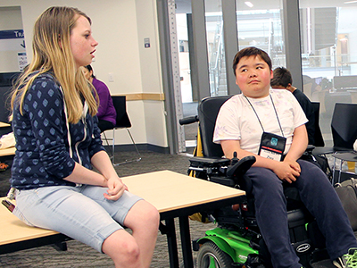 Courtney Chats with a student about her internship experience.