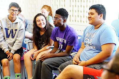 Students sit and discuss.